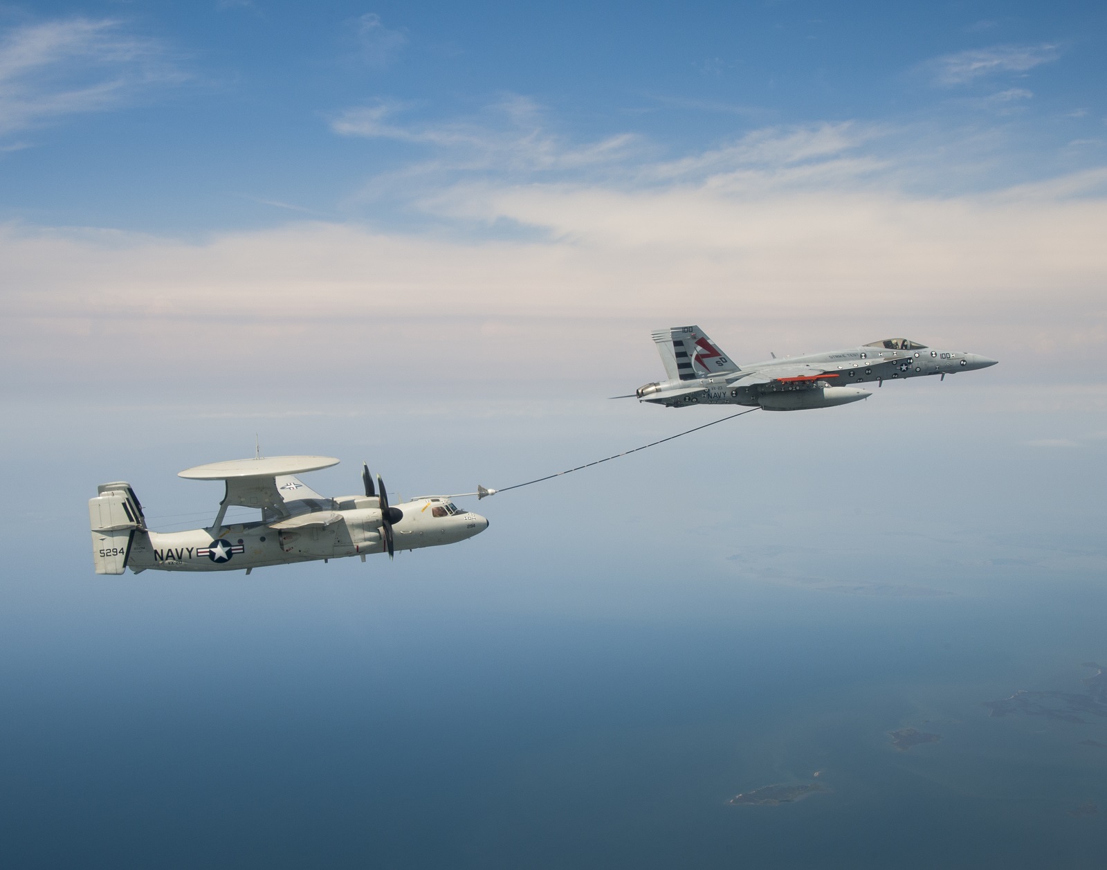 An E-2C undergoes "dry plug" testing behind an F/A-18.  U.S. Navy photo.
