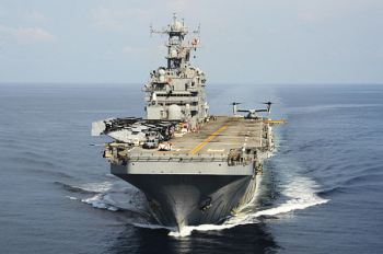 PHILIPPINE SEA (Oct. 22, 2014) The amphibious assault ship USS Peleliu (LHA 5) is underway as part of the Peleliu Amphibious Ready Group and is conducting joint forces exercises in the U.S. 7th Fleet area of responsibility. U.S. Navy Photo by Mass Communication Specialist 1st Class Joshua Hammond.