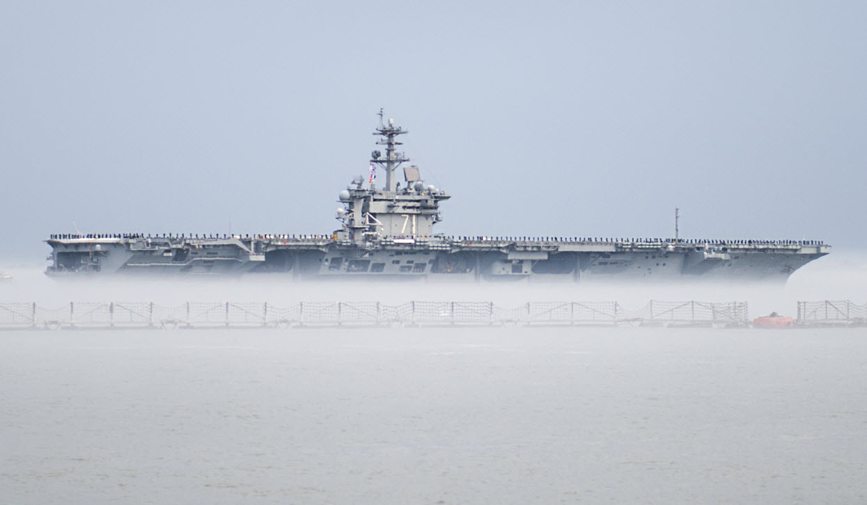  NORFOLK (March 11, 2015) The aircraft carrier USS Theodore Roosevelt (CVN 71) departs Naval Station Norfolk for a scheduled deployment. The deployment is part of a regular rotation of forces to support maritime security operations, provide crisis response capability, and increase theater security cooperation and forward naval presence in the 5th and 6th Fleet areas of operation. U.S. Navy photo by Mass Communication Specialist 2nd Class Justin Wolpert.