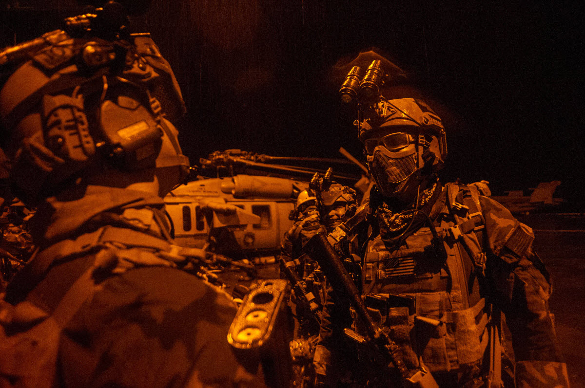 PACIFIC OCEAN (Sept. 28, 2014) Maritime special operations forces prepare for a mission during a training exercise aboard the Nimitz-class aircraft carrier USS George Washington (CVN 73). SEALs and Marine Corps special operations forces from Special Operations Command Pacific conducted maritime interoperability training aboard Nimitz-class aircraft carrier USS George Washington. George Washington and its embarked air wing, Carrier Air Wing (CVW) 5, provide a combat-ready force that protects and defends the collective maritime interests of the U.S. and its allies and partners in the Indo-Asia-Pacific region. U.S. Navy photo by Mass Communication Specialist Seaman Everett Allen.