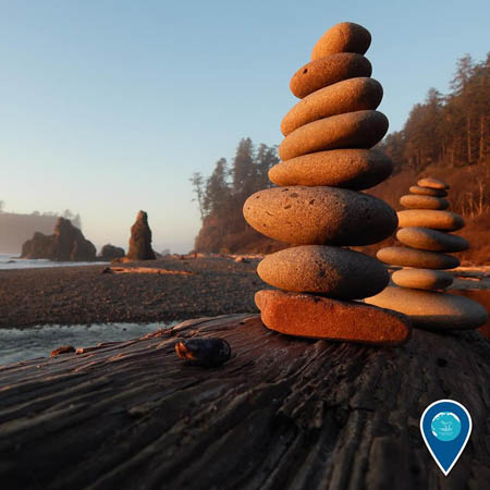 photo of rocks stacked on a beach