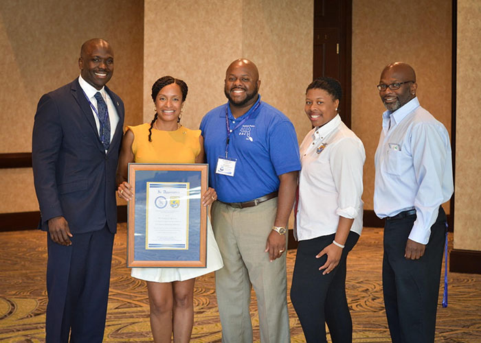 Nancy Monroe, Tiana Jones  with award fom Sigma