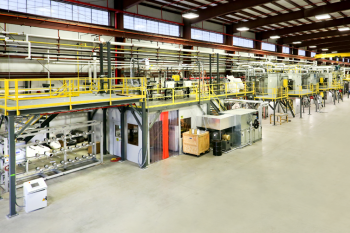 The Energy Departmentâ€™s Carbon Fiber Technology Facility at Oak Ridge National Laboratory provides clean energy companies and researchers with the opportunity to develop less expensive, better-performing carbon fiber materials and manufacturing processes. Pictured here is the carbon fiber conversion line with the in-line melt spinner. The melt-spinner will be used to produce new precursor fibers that will then be converted to carbon fiber. In collaboration with industrial partners, these fibers will be used to produce prototype composite parts for applications, such as automotive parts, wind turbine blades and thermal insulation. | Photo courtesy of Oak Ridge National Laboratory.