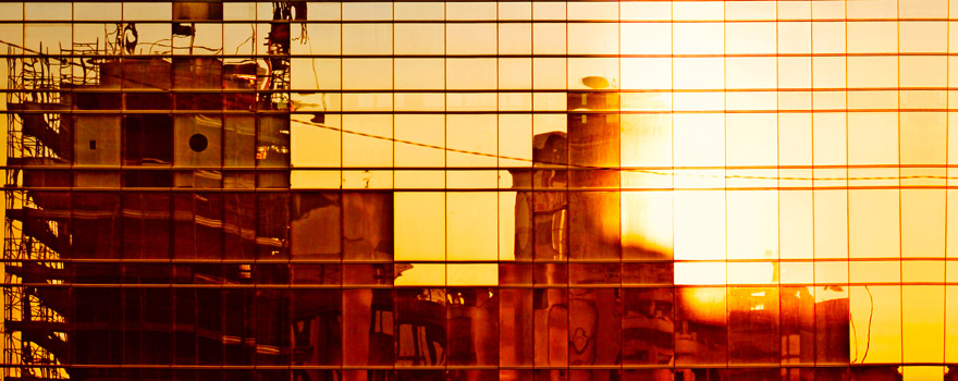 Reflection of construction work in a window building