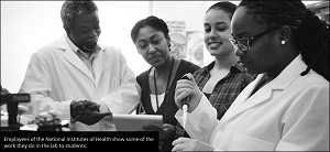 NIH employees demonstrate lab work to students