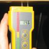 A moisture meter verifies that the moisture of the framing is below the recommended 18%