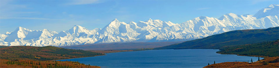 scenic view of lake and snowy mountain