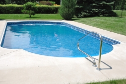 You can reduce the cost of heating your swimming pool by installing a high-efficiency or solar heater, using a pool cover, managing the water temperature, and using a smaller pump less often. | Photo courtesy of Â©iStockphoto/herreid