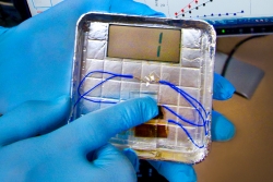 By applying pressure to the generator, one is able to generate about six nanoamperes of current and 400 millivolts of potential -- roughly a quarter of the voltage of a AAA battery and enough to flash a number on the small LCD screen. | Photo courtesy of Seung-Wuk Lee's lab at Lawrence Berkeley National Laboratory.
