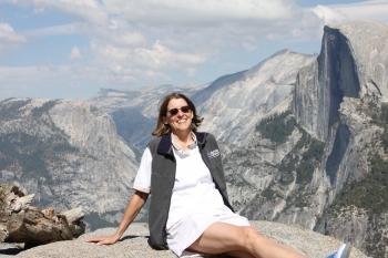 Dr. Tammy Dickinson, Principal Assistant Director for Environment and Energy at the White House Office of Science and Technology Policy, takes a break to look out over Yosemite National Park. | Photo courtesy of the White House Office of Science and Technology Policy.
