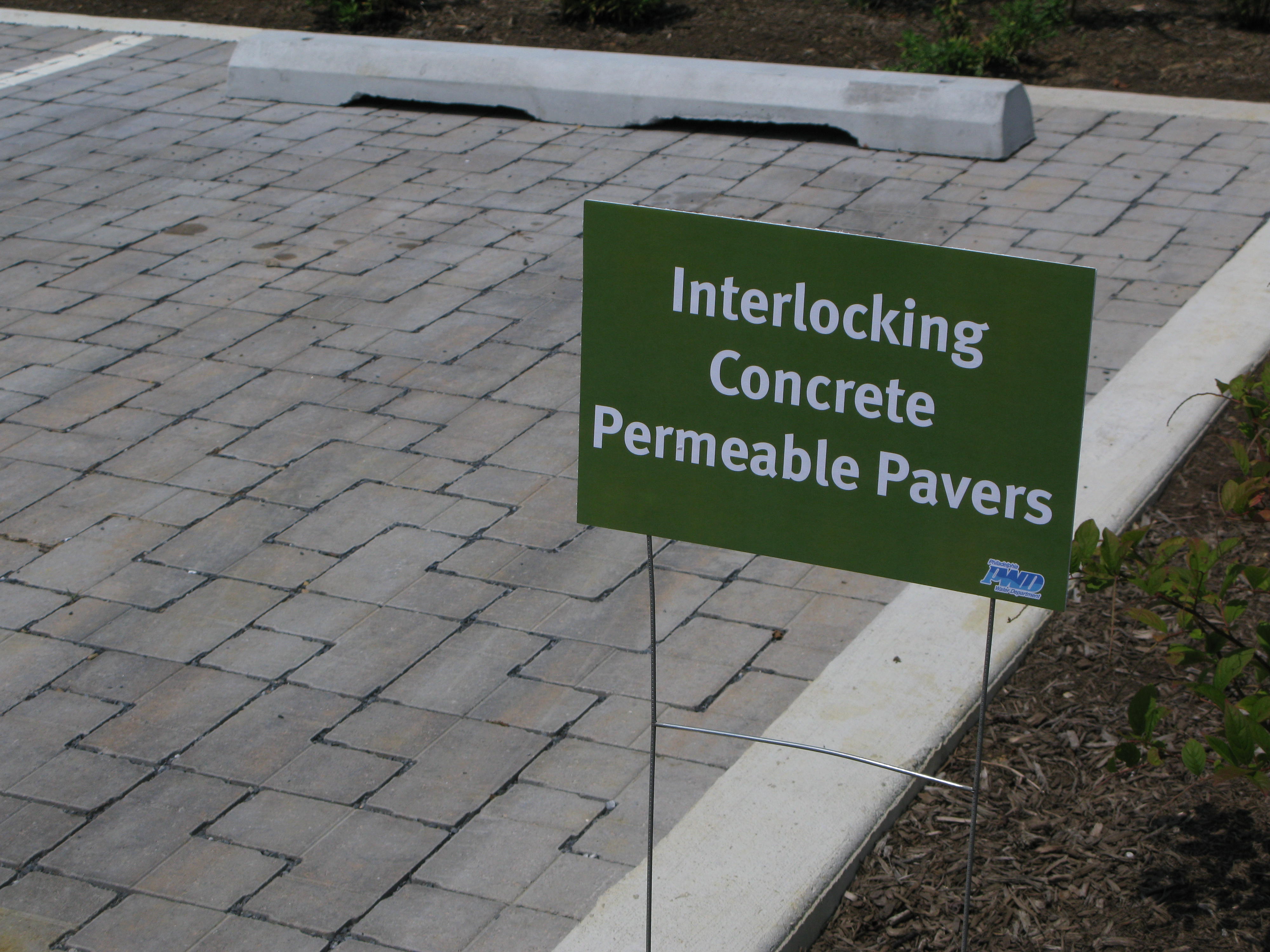 A Philadelphia Water Department parking lot includes interlocking concrete permeable pavers and other types of permeable pavements