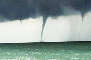 Multiple water spouts in the distance