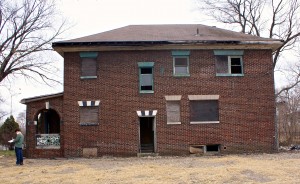 Workers deconstructing a home.