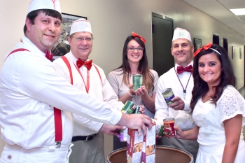 Oak Ridge Integrated Support Center employees Josh Clark (from left), Steve Martin, Katelynn Prutsman, Tom Rizzi and Hailey Beeler gave employees ice cream from a make-shift "ice cream truck" in exchange for non-perishable items. They even dressed the part! | Photo courtesy of Oak Ridge Integrated Support Center. 