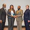 Drenda Williams accepts the NOPBNRCSE organizations Drum Major for Service Award.