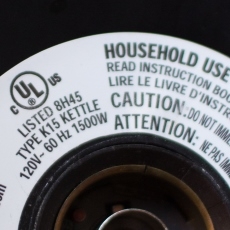 Photo of a label from an electric kettle showing a wattage of 1500.