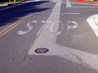 photograph of a street cross cut by new pavement