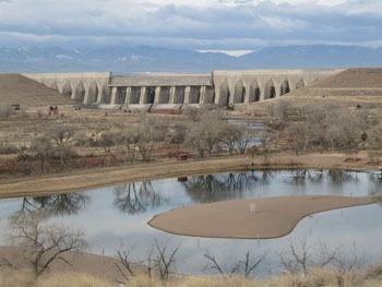 Trees have no leaves as we look west across the recreation area up to Pueblo Dam.