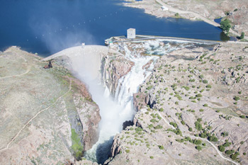 Pathfinder Reservoir Flows Over the Uncontrolled Spillway at Pathfinder Dam, June 17, 2016.