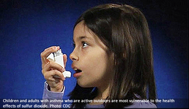 girl with asthma inhaler