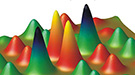 In an iron-based superconductor, model patterns of electron spins show two competing liquid-like magnetic phases. (Positive spins correspond with yellow and red, while negative spins are green and black.)