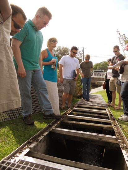 Workshop attendees inspect a newly installed fishway at Argyle Lake in Babylon, NY.  