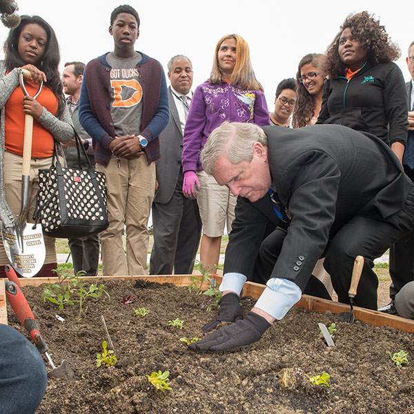 Agriculture Secretary Tom Vilsack planting at Frederick Douglass High School’s new community garden in Baltimore, Md