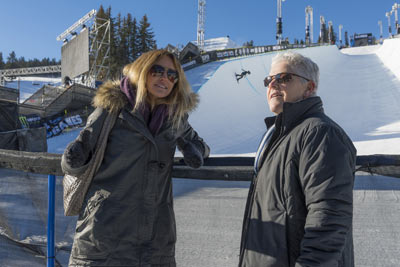 Administrator McCarthy and snowboarder Gretchen Bleiler standing in front of a snow halfpipe.