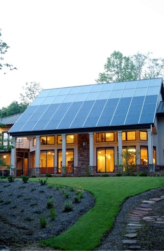 This North Carolina home gets most of its space heating from the passive solar design, but the solar thermal system supplies both domestic hot water and a secondary radiant floor heating system. | Photo courtesy of Jim Schmid Photography, NREL