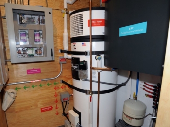 This utility room includes a heat pump water heater. | Photo courtesy of Thomas Kelsey/U.S. Department of Energy Solar Decathlon