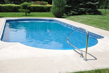 You can reduce the cost of heating your swimming pool by installing a high-efficiency or solar heater, using a pool cover, managing the water temperature, and using a smaller pump less often. | Photo courtesy of Â©iStockphoto/herreid