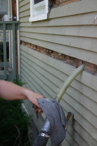 In existing homes, cellulose (here) or other loose-fill materials can be installed in building cavities through holes drilled (usually) on the exterior of the house. After the installation, the holes are plugged and finish materials replaced. | Photo courtesy of Cellulose Insulation Manufacturers Association.