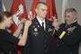 U.S. Army 1LT Michael Kukesh pinned to the rank of Captain by Brig. Gen. Richard G. Kaiser, Commanding General U.S. Army Corps of Engineers Great Lakes and Ohio River Division and his wife Sarah Kukesh, during a promotion ceremony at the John W. Peck Federal Building in Cincinnati, Ohio on October 30, 2015. (U.S. Army photo by Prentiss J. Haney/Released)
