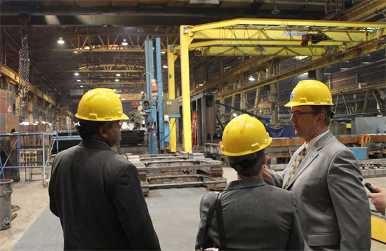 Assistant Administrator Mathy Stanislaus and David Abshire, Vice President of LB Steel tour the LB steel products factory.