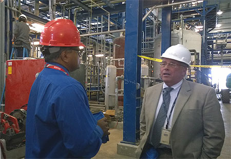 Mathy Stanislaus speaks with a chemical facility representative.