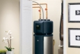 The GE GeoSpring™ Electric Heat Pump Water Heater is readily integrated into new and existing home designs. Taking up the same footprint as a traditional 50-gallon tank water heater, the Electric Heat Pump Water Heater uses the existing water heater's plumbing and electrical connections. Credit: GE