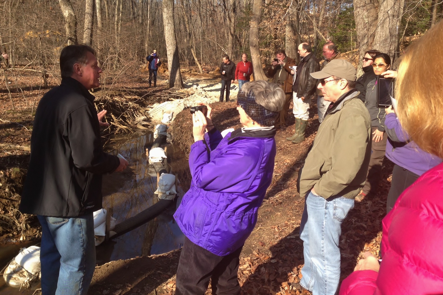 Keith Underwood outlines the progress of the Cabin Branch Regenerative Stream Conveyance restoration project for members of the Chesapeake Bay Program and Maryland Department of Natural Resources .  The project was initiated by the Severn Riverkeeper Program. (photo by Tom Wenz, EPA CBPO)