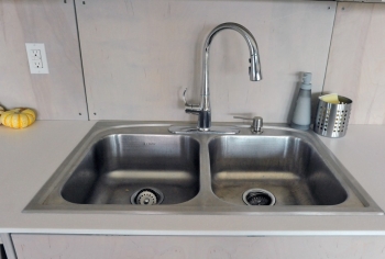 Fix leaky faucets to save $35 and 1,661 gallons of water. | Photo courtesy of Thomas Kelsey/U.S. Department of Energy Solar Decathlon