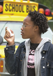 Girl using inhaler