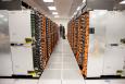 A view of one of the aisles of racks that hold Sequoia’s 1.6 million cores. Its 16.32 sustained petaflops and 1.6 petabytes of memory make it the world's fastest supercomputer. | Photo courtesy of Lawrence Livermore National Laboratory. 