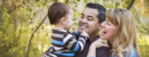 News and Spotlight mini banner - Multi-cultural family in park