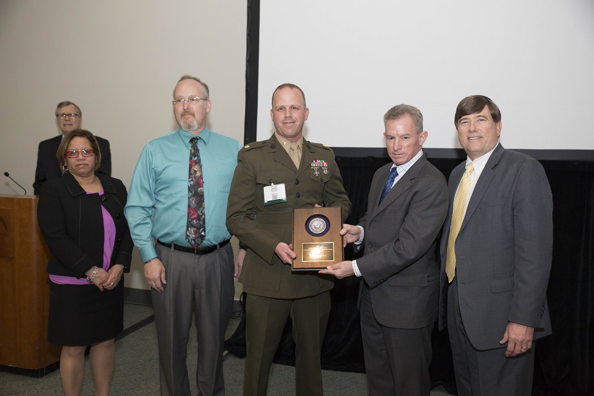 Mr. Robert Foster, Department of the Navy Chief Information Officer (DON CIO); Ms. Janice Haith, Director, DON Deputy CIO (Navy); and Mr. Kenneth Bible, Deputy Director, HQMC C4, U.S. Marine Corps, presented a DON IM/IT Excellence Team Award to Maj Jason Jones and Greg Smith of the Deployable MCEN Team, Marine Corps Tactical Systems Support Activity (MCTSSA) during the awards ceremony at the DON IT West Coast Conference on February 17, 2016.