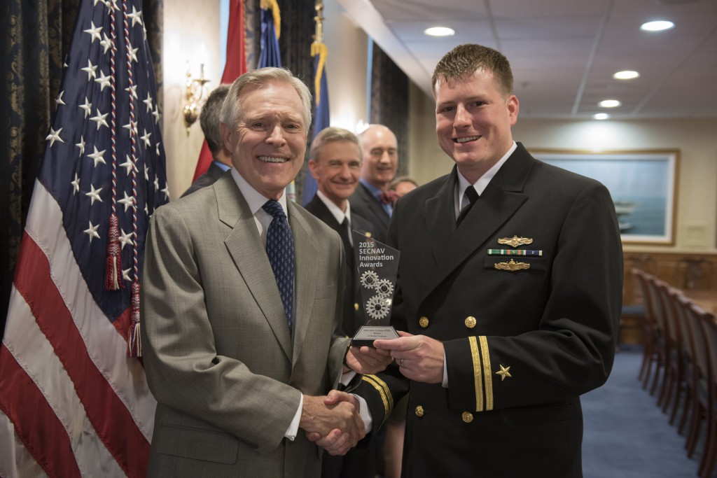 WASHINGTON (April 21, 2016) Secretary of the Navy (SECNAV) Ray Mabus presents Lt. Brendan Geoghegan from the Naval Postgraduate School with the 2015 SECNAV Innovation Award for the Innovation Scholar (PME) category during a ceremony at the Pentagon. Mabus created the annual innovation awards program as part of Task Force Innovation to formally recognize talented innovators in the operational and supporting forces of the Department of the Navy.  U.S. Navy photo by Mass Communication Specialist 2nd Class Armando Gonzales 