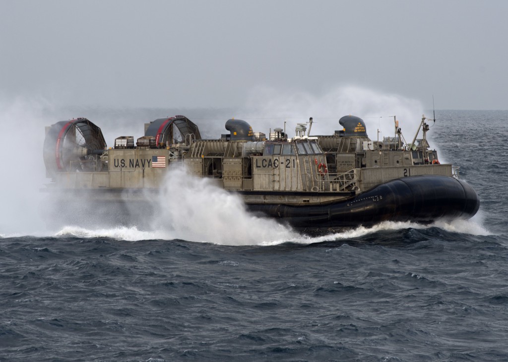 SASEBO BAY, Japan: A Landing Craft Air Cushion (LCAC), attached to Naval Beach Unit (NBU) 7 departs amphibious dock landing ship USS Germantown (LSD 42).  U.S. Navy photo by Mass Communication Specialist 3rd Class James Vazquez 