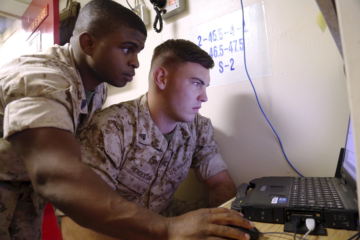 Corps’ acquisition arm pursues accelerated cyber acquisition to respond to needs of force - Marines with the 13th Marine Expeditionary Unit set up network communications aboard the USS Boxer during an integration exercise in 2015. The Marine Corps is developing a fully unified command and control construct, integrating cyber and IT capability development processes and streamlining IT acquisition and procurement processes. These improvements will provide more responsive and effective support to the operational force. U.S. Marine Corps photo by Staff Sgt. Terika S. King 

