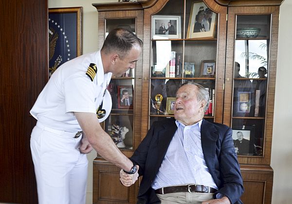 HOUSTON (Oct. 18, 2016) Capt. Gavin Duff, executive officer of USS George H.W. Bush (CVN 77), greets President George H.W. Bush during a visit to Houston, Texas, for Houston Navy Week.  Navy Weeks, coordinated by the Navy Office of Community Outreach (NAVCO), are designed to give Americans the opportunity to learn about the Navy, its people and its importance to national security and prosperity. U.S. Navy photo by Chief Petty Officer Jen Blake.