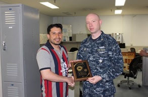 Chief Warrant Officer (CWO2) William Behr presenting Mr. Henry Coy with the Civilian of the Year Award