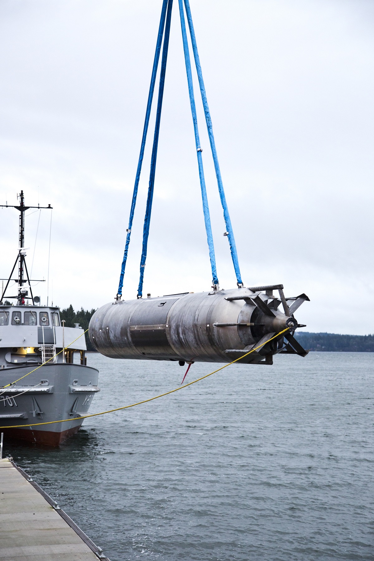 A surrogate Large Displacement Unmanned Undersea Vehicle (LDUUV)is submerged in the water in preparation for a test to demonstrate the capability of the Navy's Common Control System (CCS) at the Naval Undersea Warfare Center Keyport in Puget Sound, Wash. in December 2015.  U.S. Navy photo 