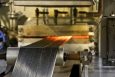 Oxidized fibers move to a high temperature furnace, where material is converted into carbon fiber at Oak Ridge National Laboratory's Carbon Fiber Technology Facility (CFTC). The CFTC enables companies to test low-cost carbon fiber for use in several industries including the clean energy sector. | Photo courtesy of Oak Ridge National Laboratory