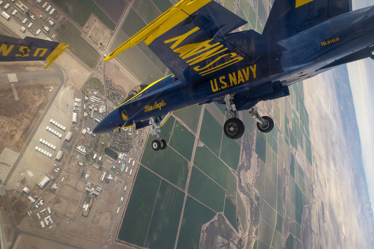 U.S. Navy flight demonstration squadron, the Blue Angels, Right Wing pilot Lt. Matt Suyderhoud flies in formation with the Diamond pilots over Naval Air Facility El Centro during a practice demonstration.
U.S. Navy photo.